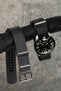 Oris divers 65 black dial fitted with black bonetto cinturini 328 rubber one piece strap buckled and hanging off pole