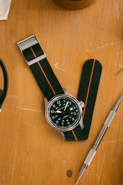 HAMILTON H70625533 Khaki Field Auto 44mm Watch - Black Dial fitted with elliot brown webbing strap in black with burnt orange stripe